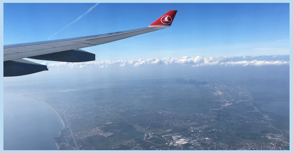 a turkish airlines plane flying in the sky