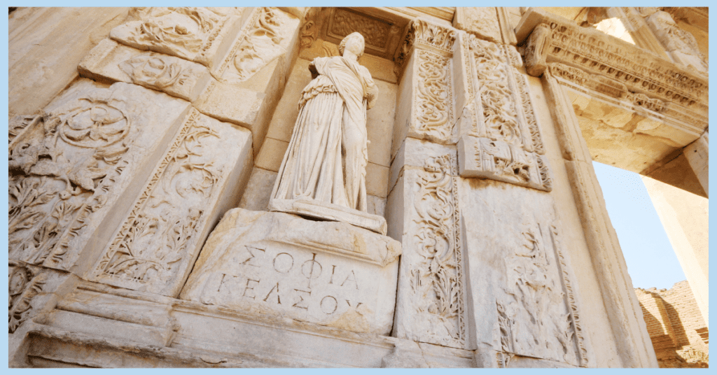 a statue at the front of the library of celsus in ephesus turkey