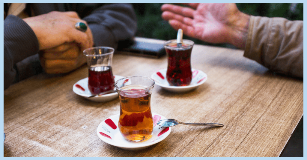 two friends spending their afternoon chatting and drinking Turkish tea